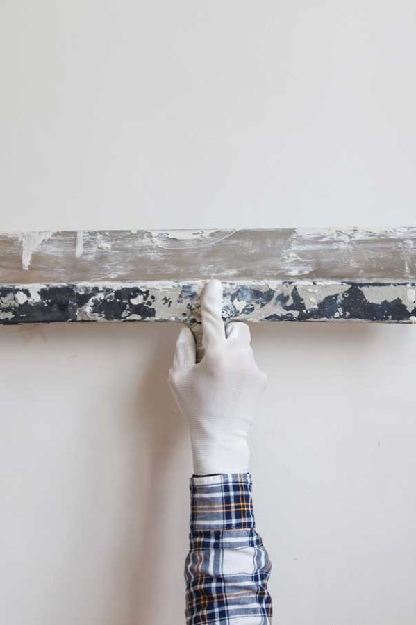 worker-in-white-gloves-performs-plastering-of-the-2021-04-02-21-13-38-utc